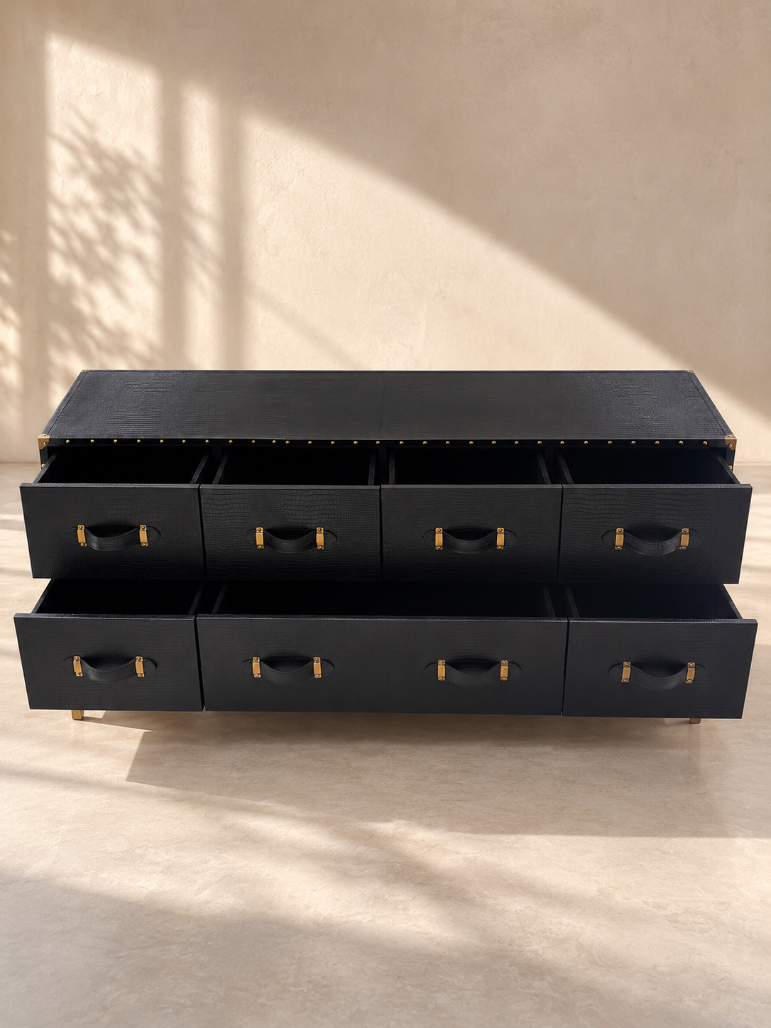 Pataudi leather chest of drawers with all seven drawers open: four above, a wide centre drawer flanked by two below — Art Avenue