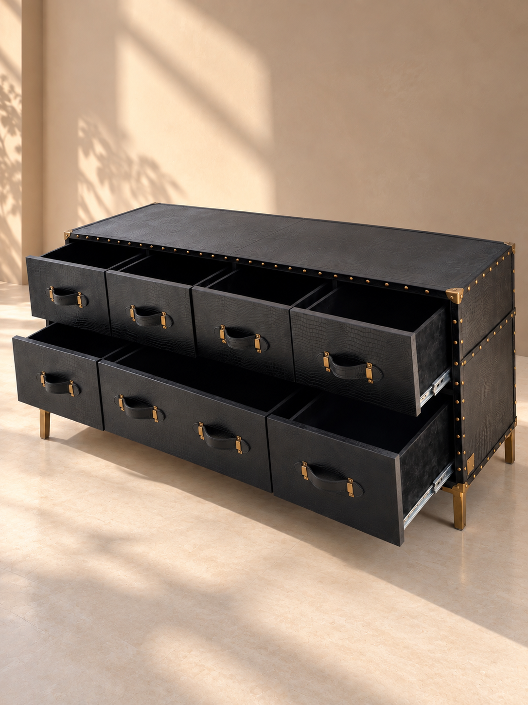 Three-quarter view of the Pataudi chest of drawers, drawers open to show full-extension runners and leather strap pulls — Art Avenue