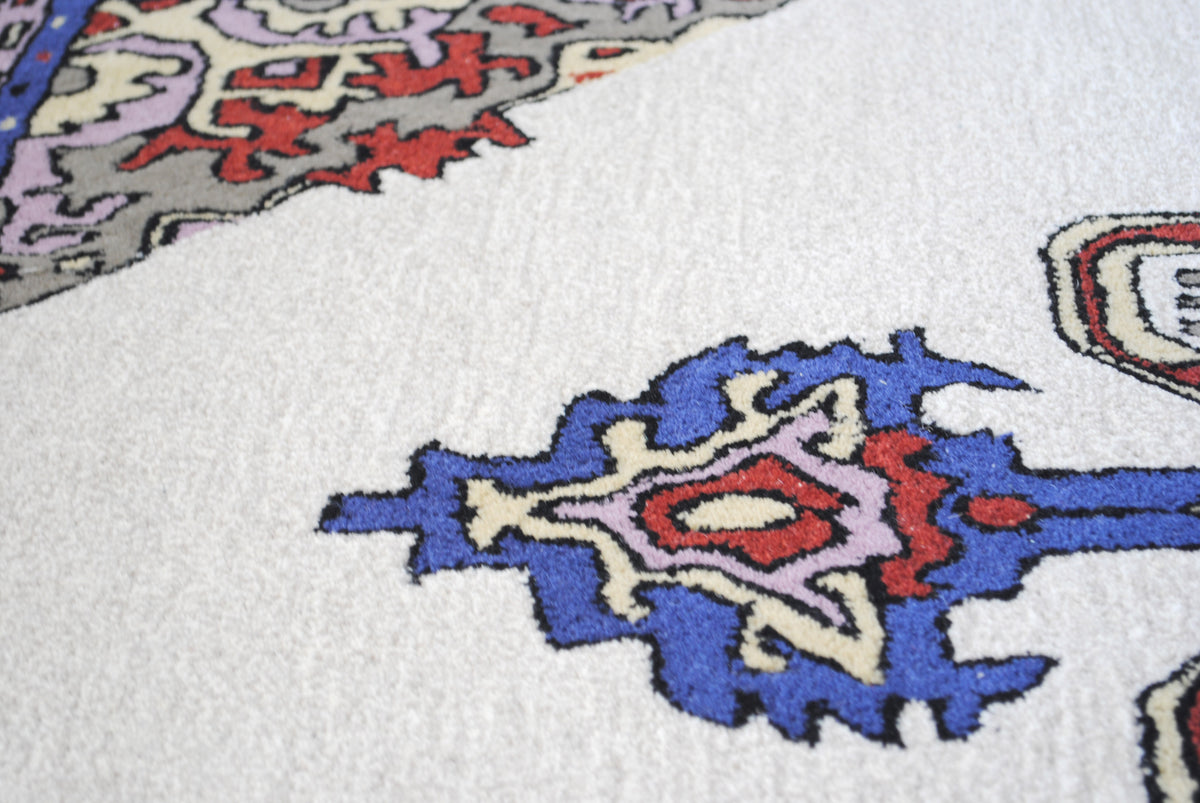 Ajmer hand-tufted wool rug with ivory, cobalt and lilac medallion