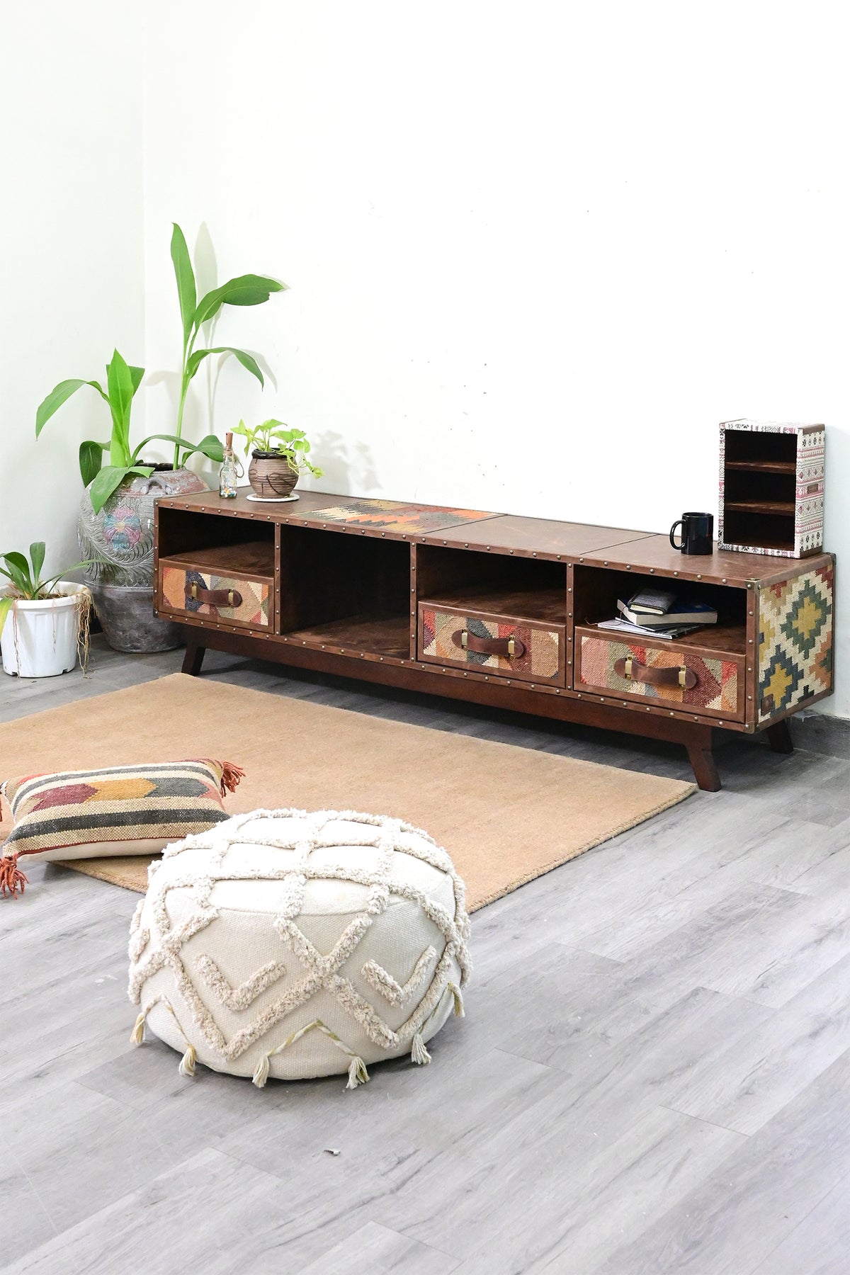 Ranakpur TV unit in a living room setting with a kilim cushion and pouffe on a wool rug