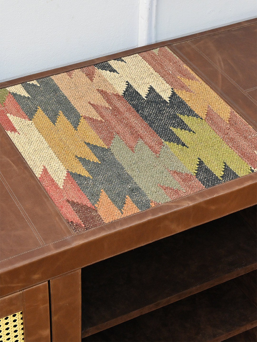 Detail of the vintage kilim inset set into the leather top, Fatehpur sideboard, Art Avenue