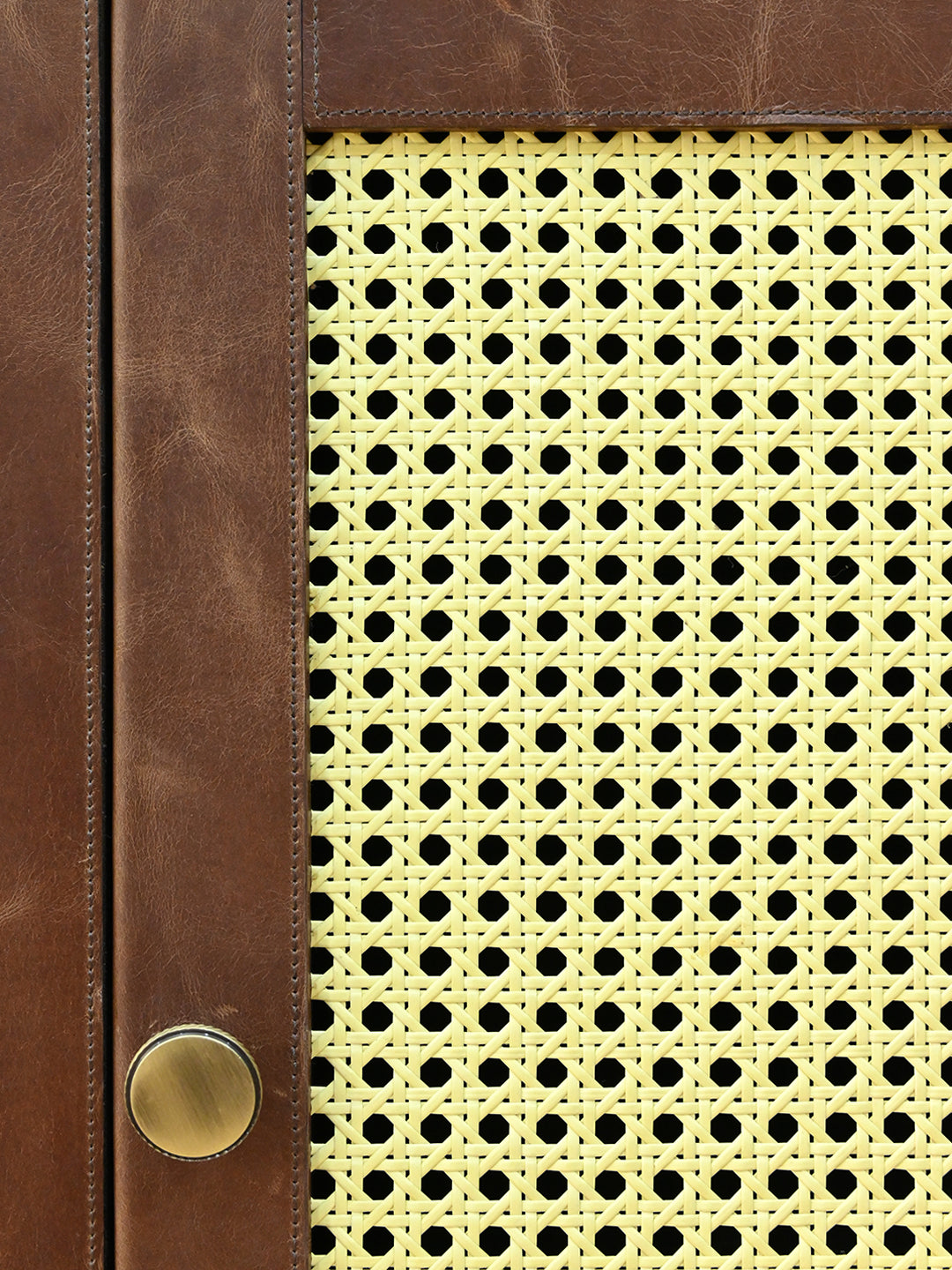 Close detail of the woven cane panel against hand-cut leather, Fatehpur sideboard, Art Avenue