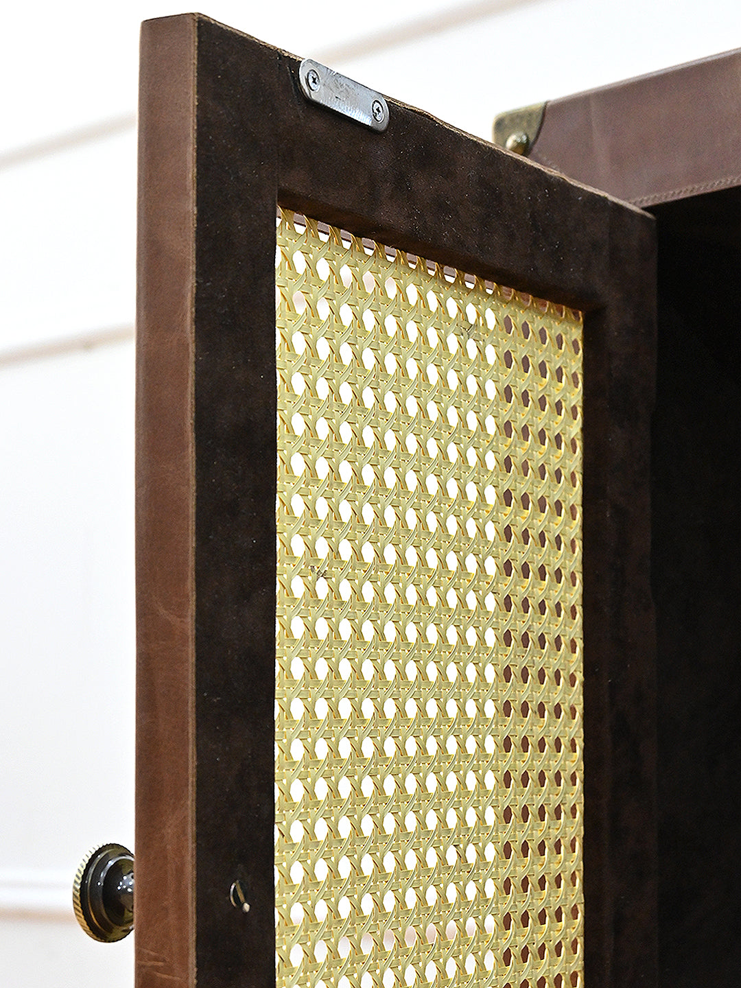 Reverse of a cane door showing the magnetic catch plate, Fatehpur sideboard, Art Avenue
