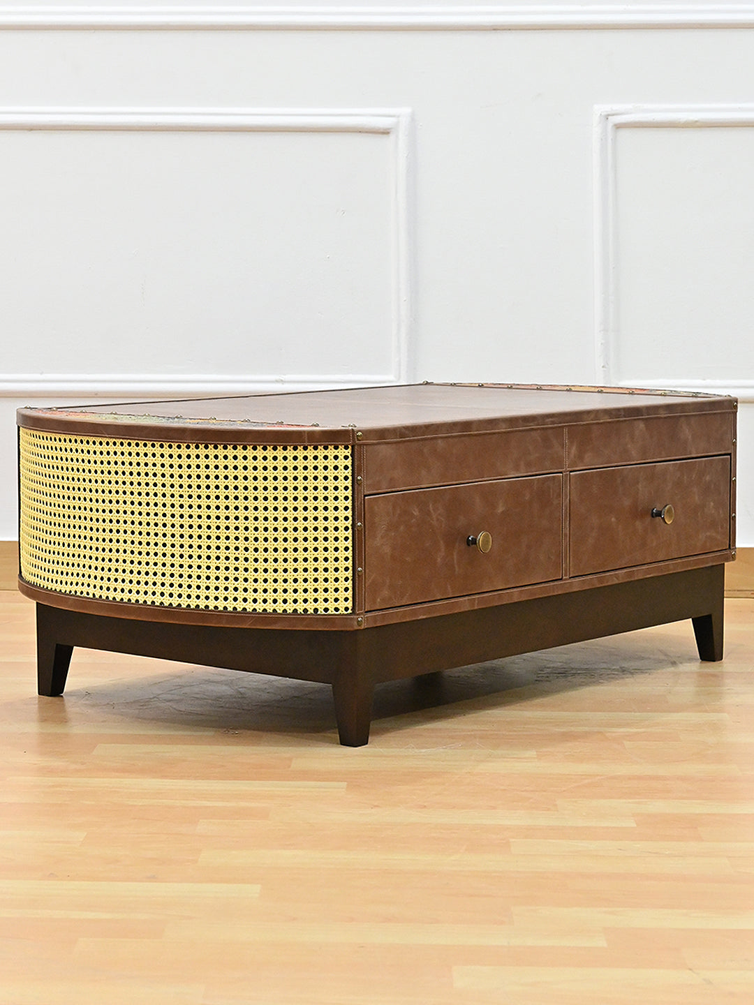 Bisalpur coffee table from the opposite three-quarter angle, cane end and solid wood plinth