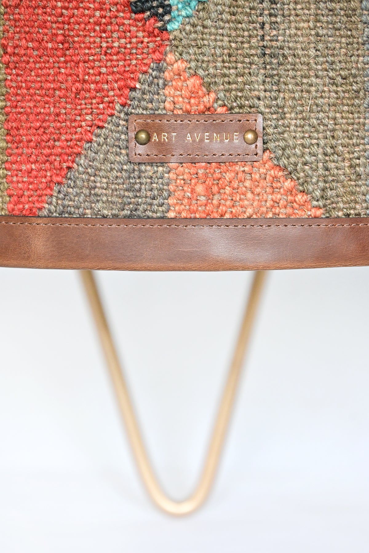 Close-up of the powder-coated metal hairpin leg on the Alwar side table
