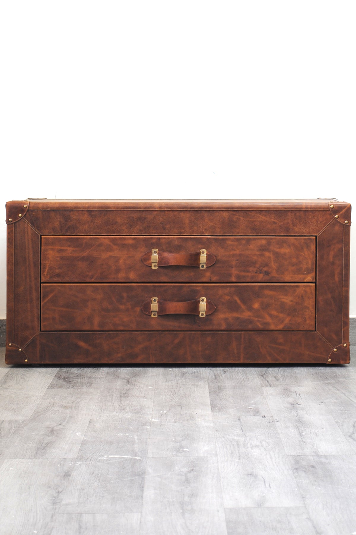Deogarh leather drawer trunk photographed straight on, showing both drawer fronts and leather strap handles