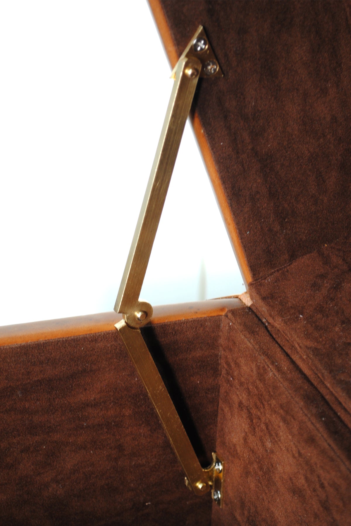 Brass scissor stay holding the lid of the Cordoba Leather Cube Trunk upright