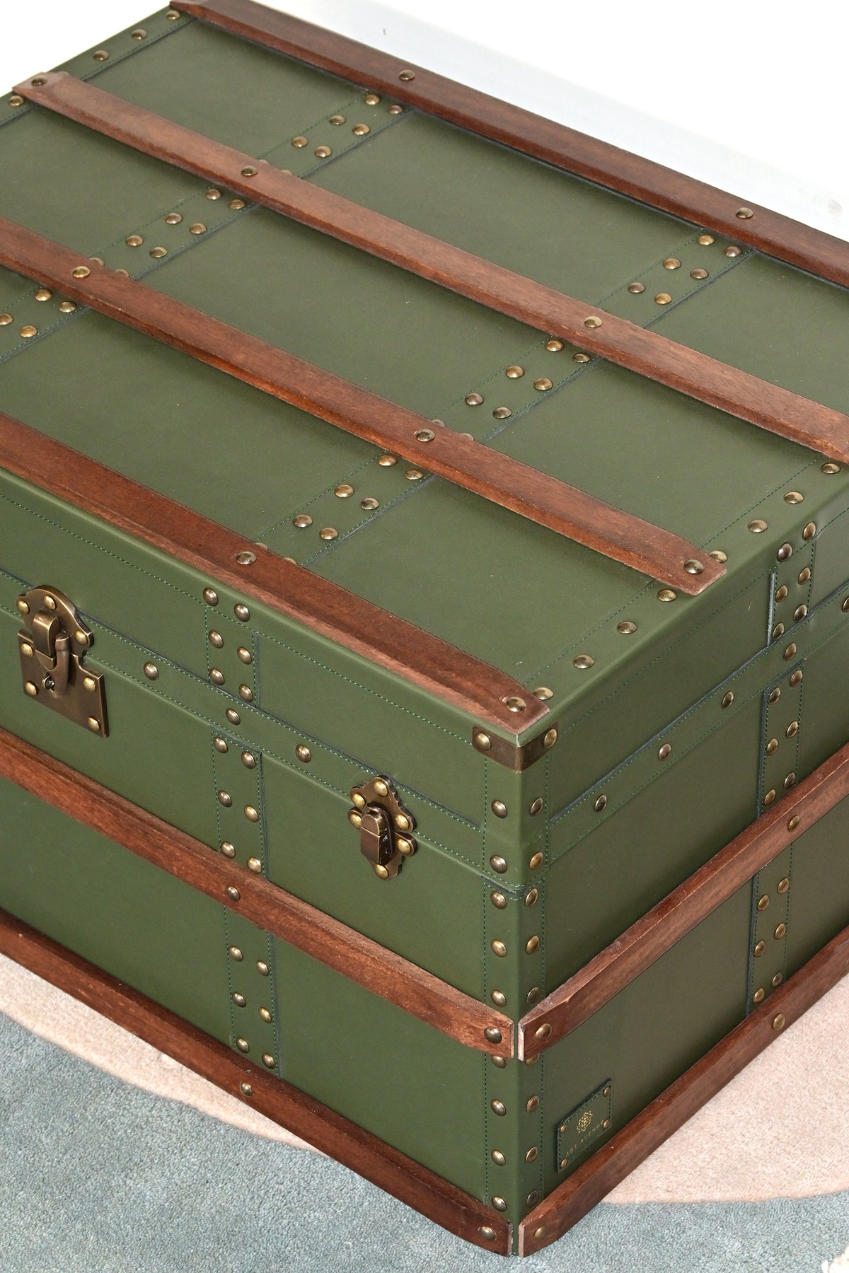 High-angle close-up of the trunk lid, wood bands and hasp — Art Avenue