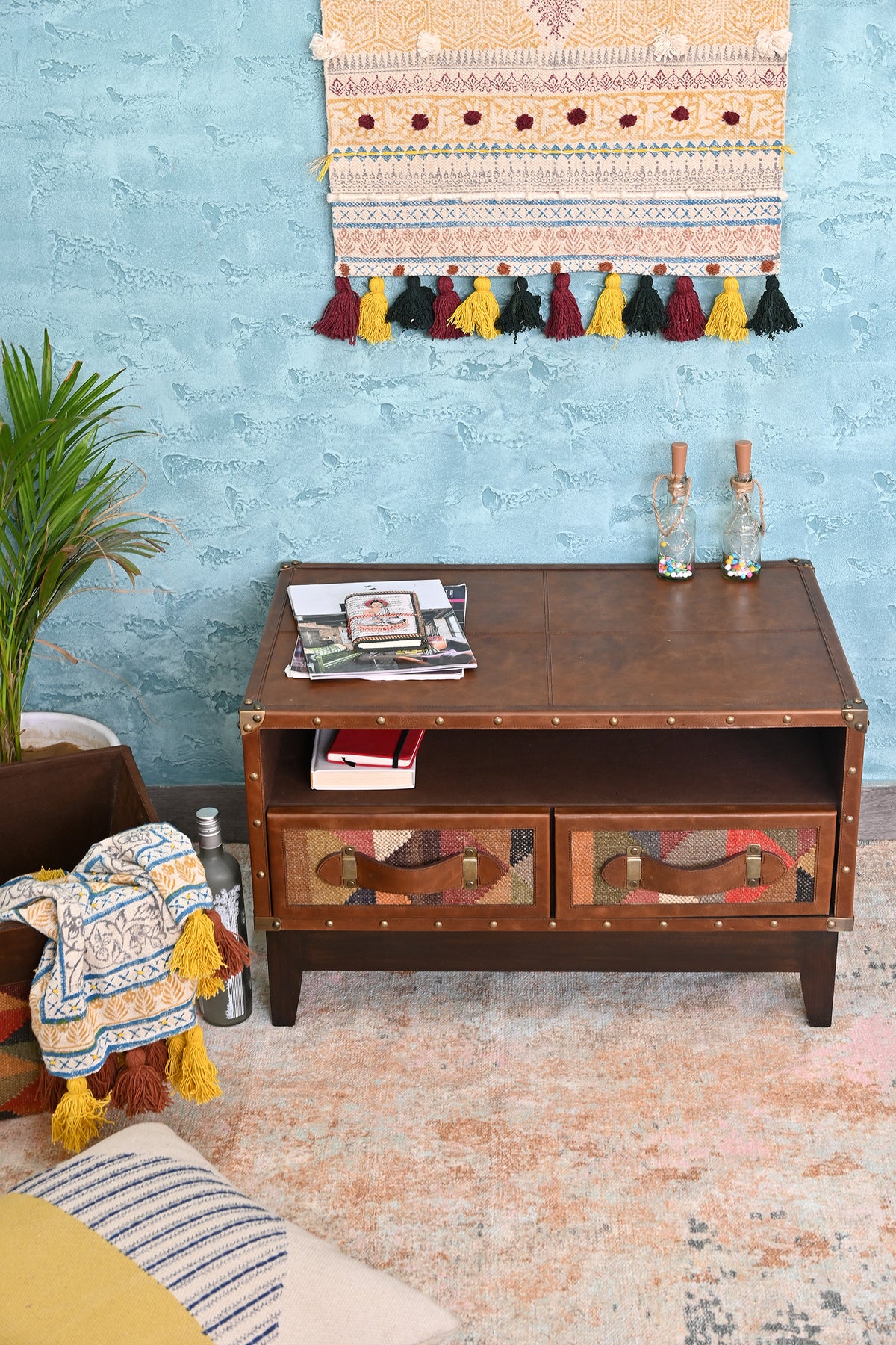 Barmer TV unit styled in a living room against a textured blue wall