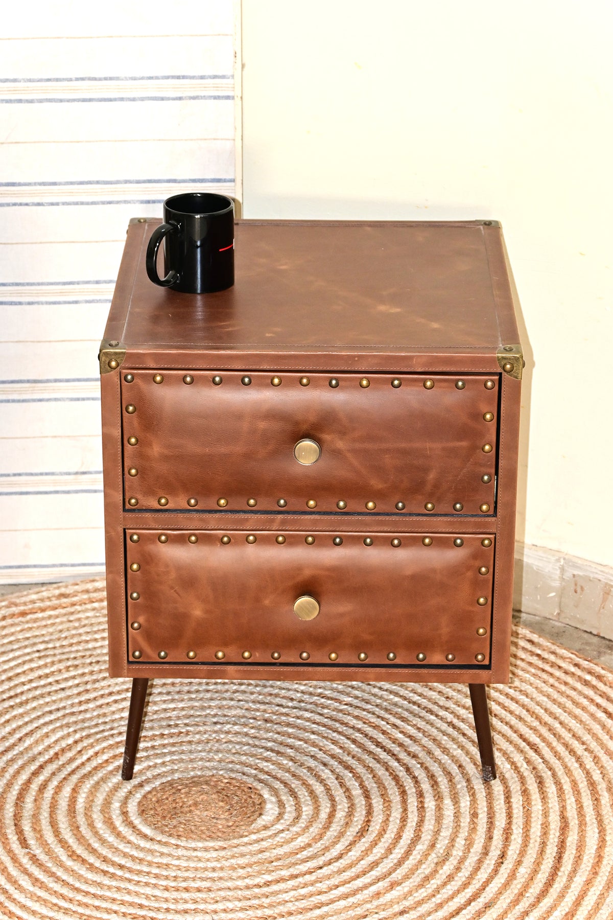 Top view of Kishangarh bedside table showing stitched inset leather top and brass corner caps, Art Avenue