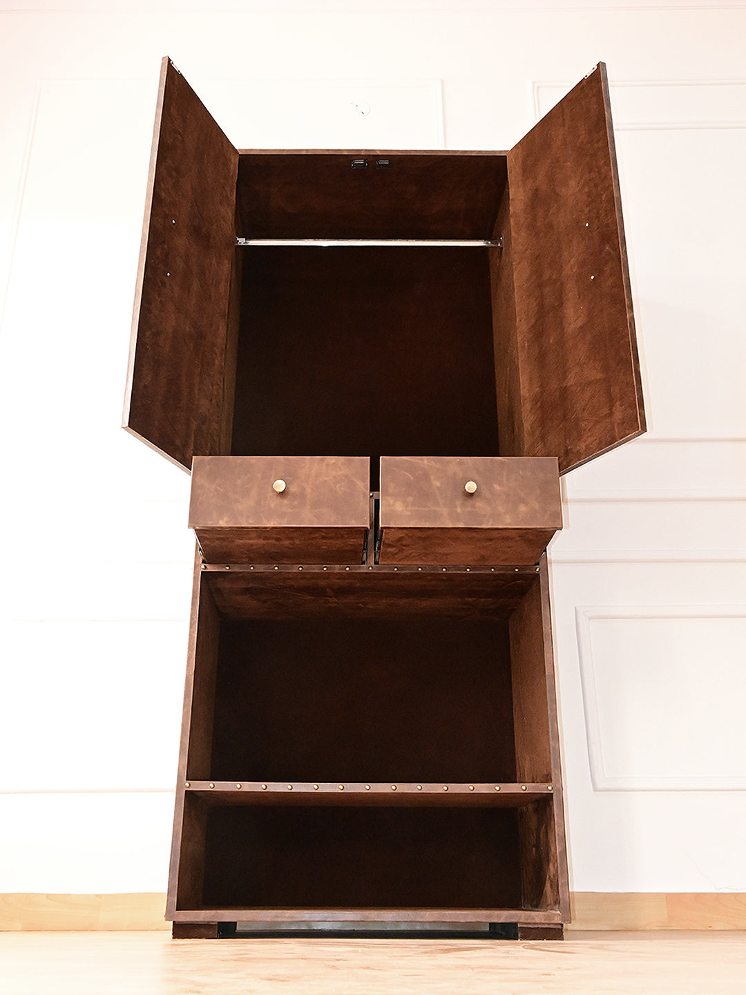 Low-angle view of the Alsisar wardrobe with doors open and drawers extended, Art Avenue