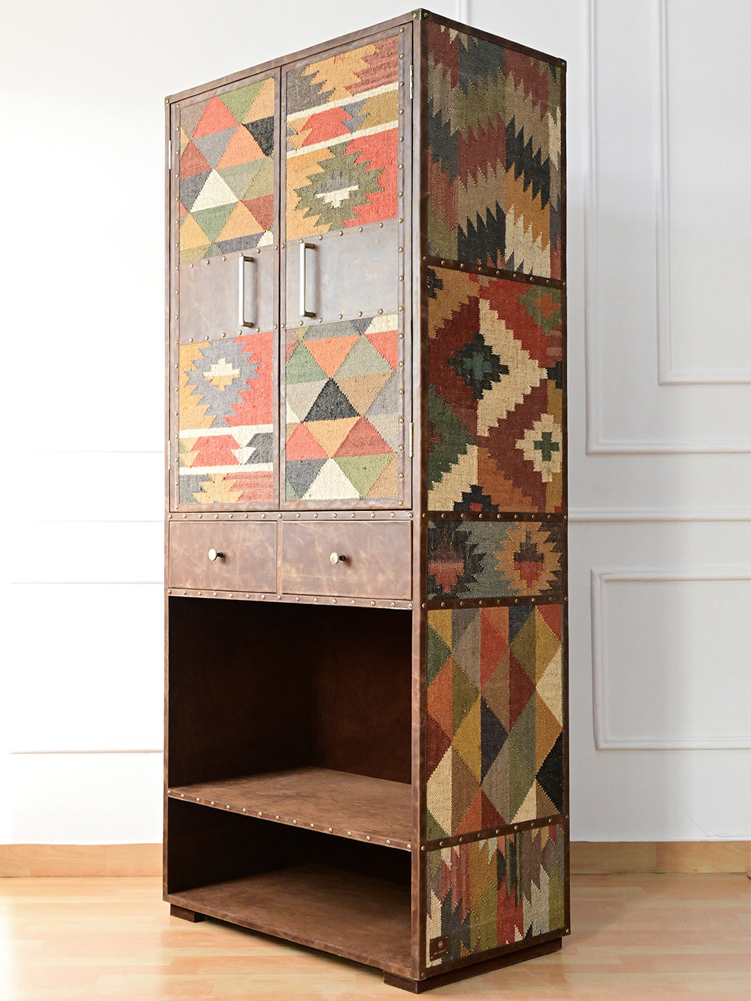 Alsisar kilim and leather wardrobe, three-quarter view showing kilim doors and kilim-panelled flank, Art Avenue, made to order