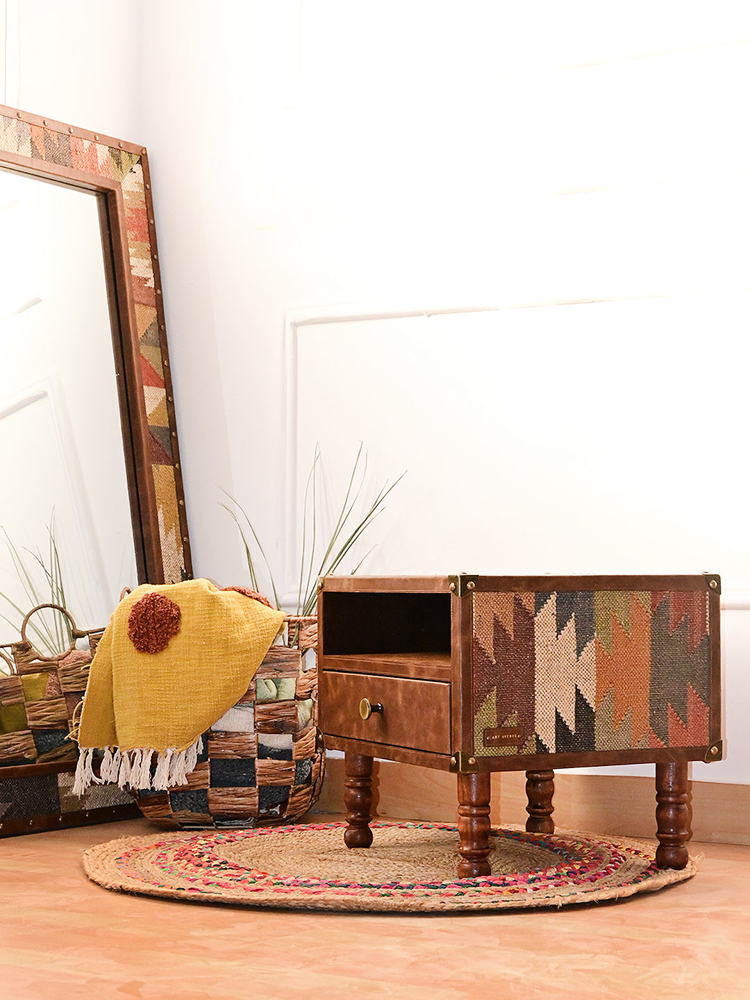 Rear three-quarter view of the Mahansar bedside table showing a second kilim pattern