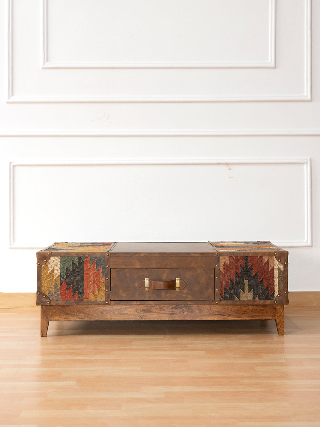 Sojat kilim and leather coffee table by Art Avenue, front view on a plain background