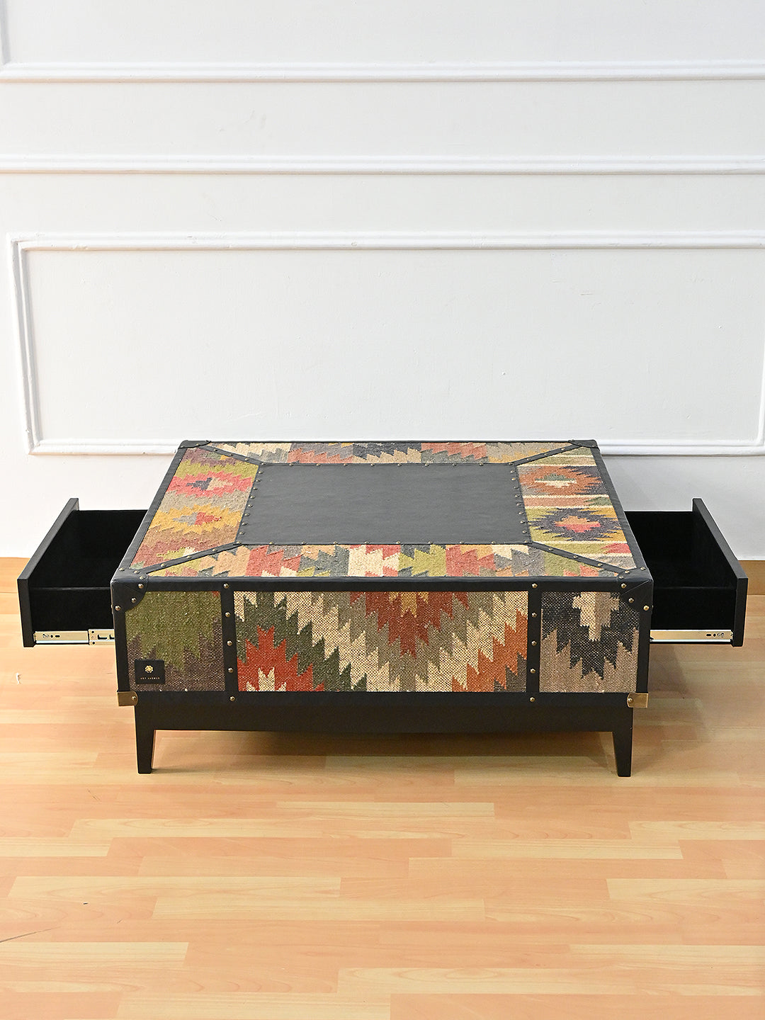 Mehrangarh coffee table with both soft-close drawers extended from opposing faces, Art Avenue kilim and Onyx leather