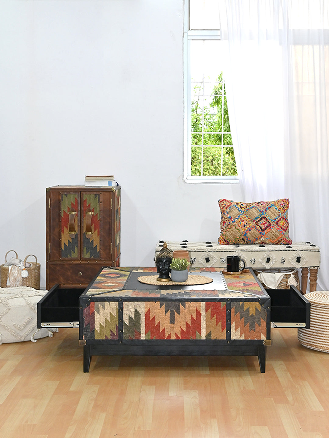 Mehrangarh coffee table anchoring a styled living room, both drawers open, Art Avenue kilim and Onyx leather