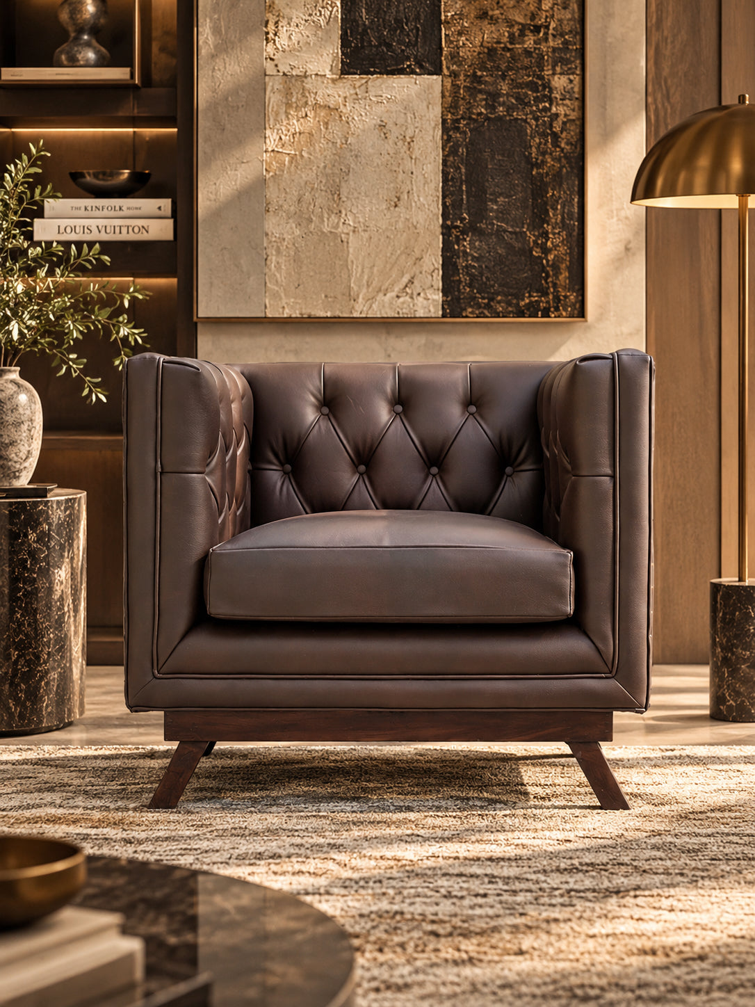 Chail buttoned leather club chair, front elevation showing the diamond-buttoned back and loose seat cushion over a solid wood plinth — Art Avenue, made to order