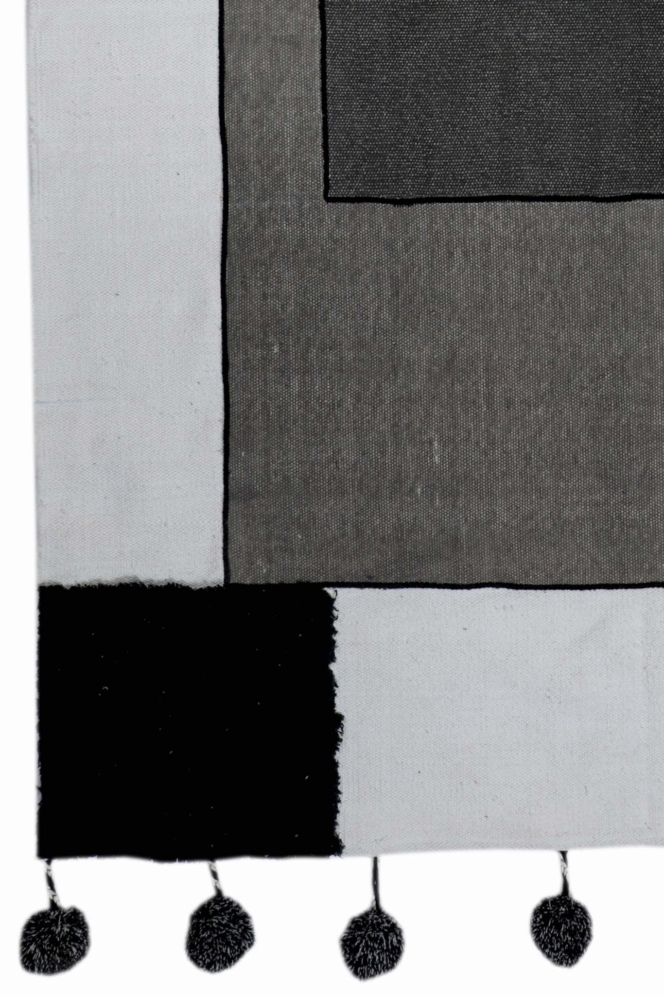 KELKI- PATCHWORK RUG WITH POM POMS - BLACK - ART AVENUE