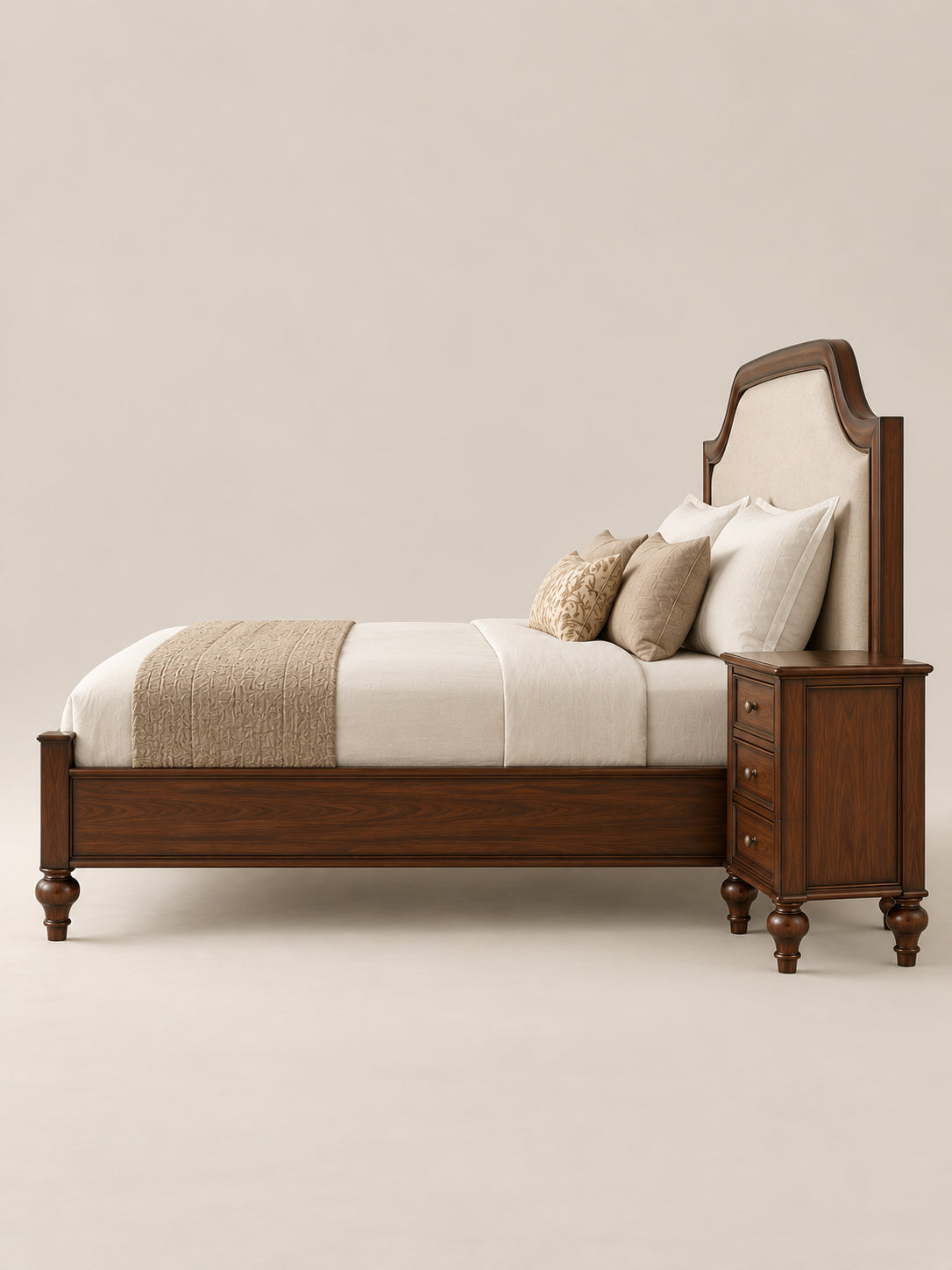 Darjeeling Colonial Bed with upholstered headboard in side profile beside its three-drawer Walnut bedside table. Art Avenue, made to order.