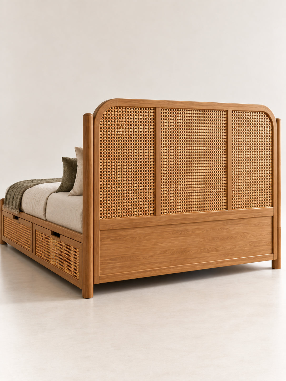 Back of the Ziro Rattan Bed headboard — rattan cane above a framed solid wood panel, finished to stand away from the wall. Art Avenue, made to order.