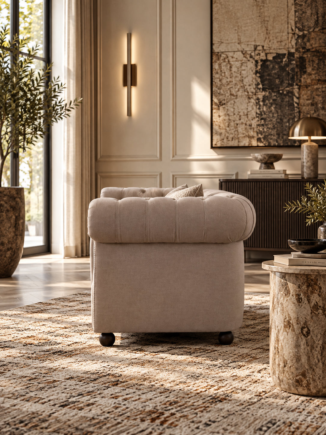 Hampstead fabric Chesterfield sofa in Pebble linen from the end, showing the plain outside arm and the buttoned roll running over the top — Art Avenue, made to order