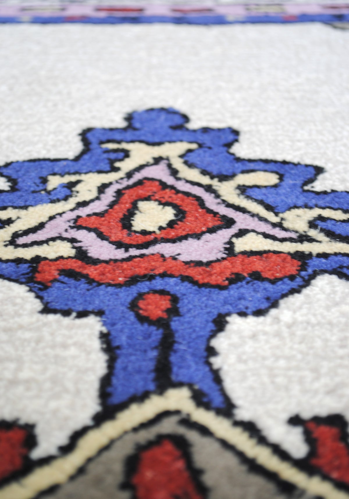 Ajmer hand-tufted wool rug with ivory, cobalt and lilac medallion