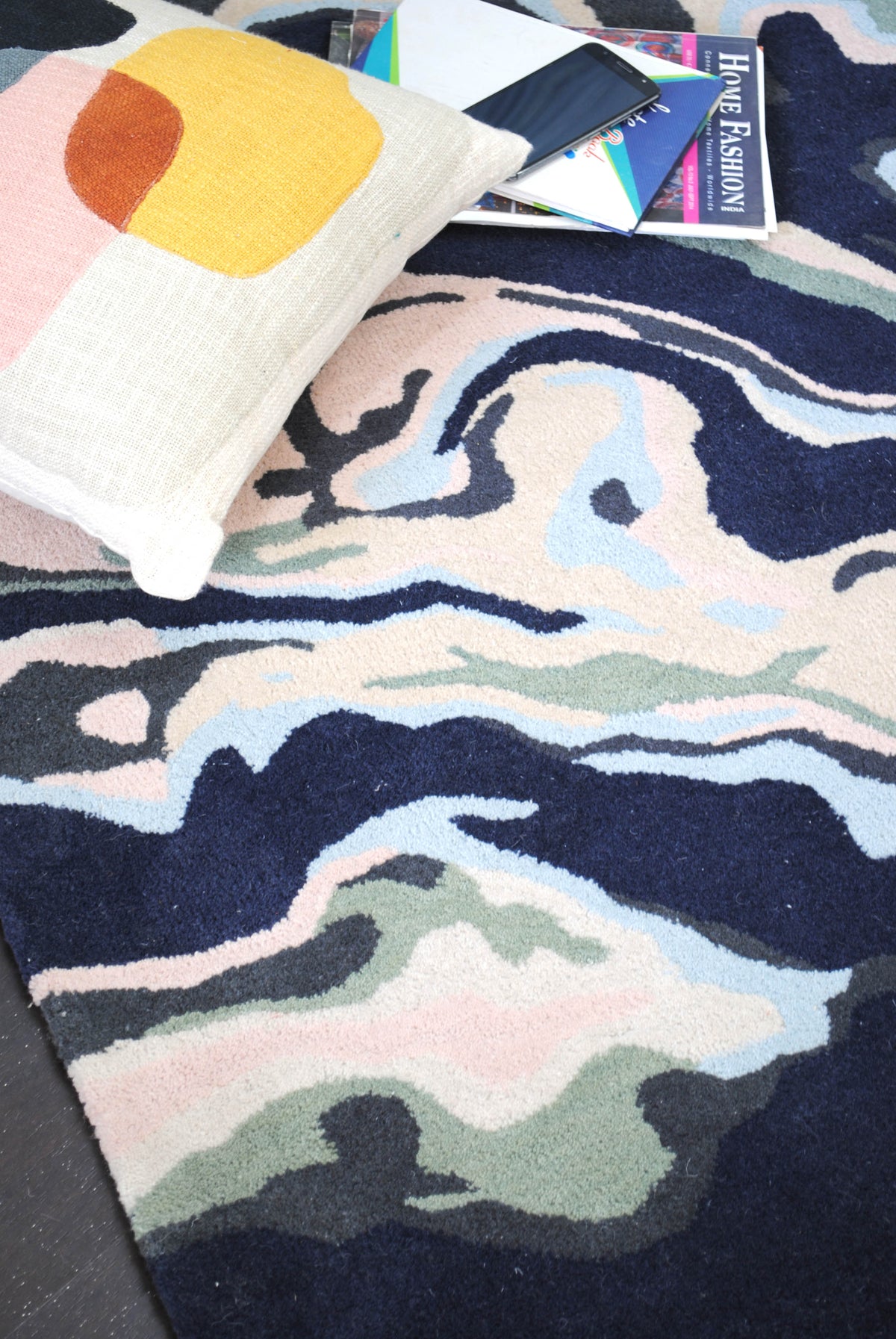 Makrana hand-tufted wool rug with marbled navy, blush and sky blue bands
