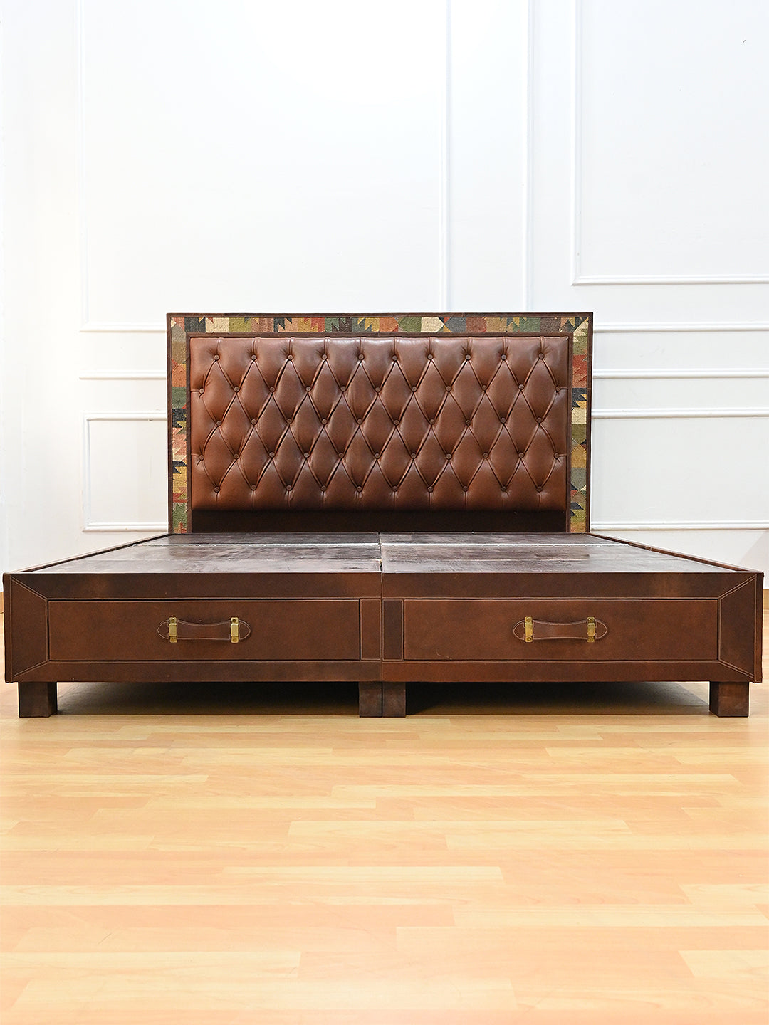 Narlai kilim and leather storage bed by Art Avenue, made to order — full front view of buttoned headboard and drawer base