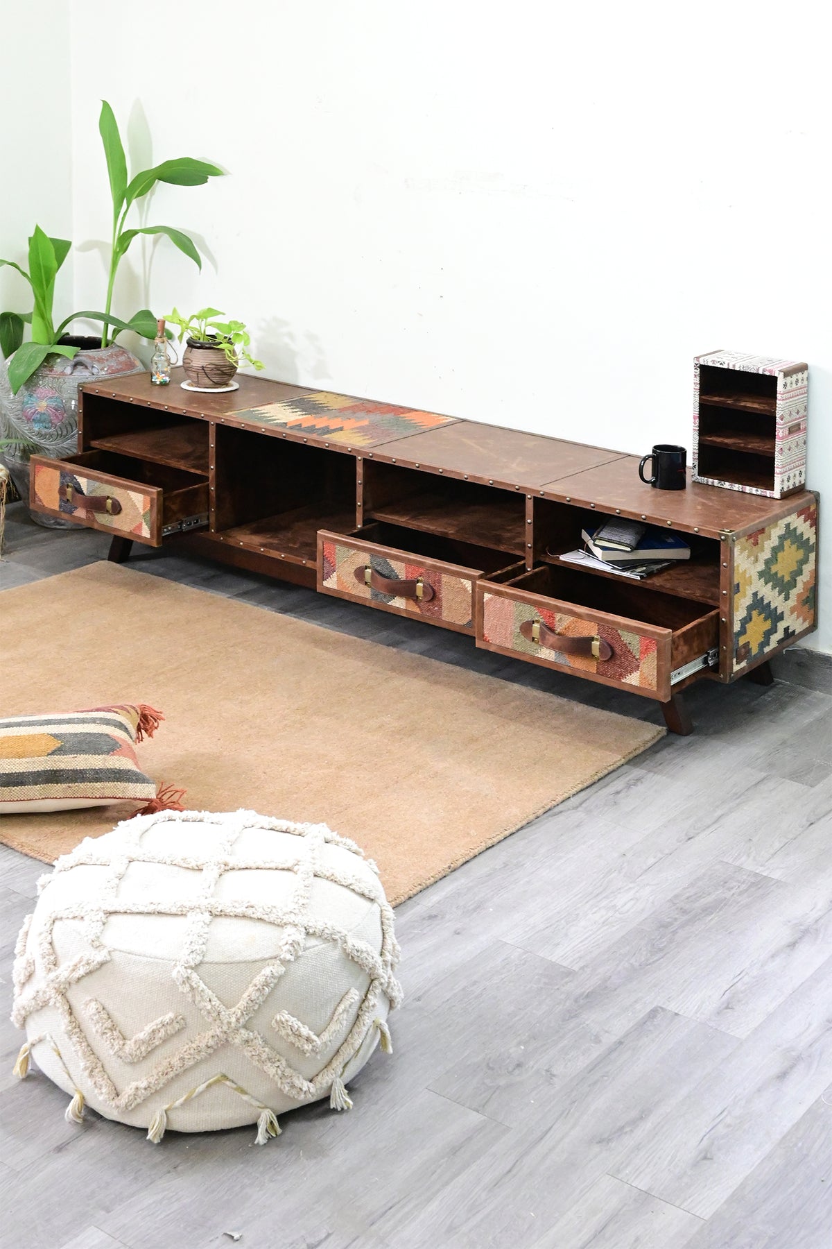 Ranakpur TV unit with all three drawers pulled open on their runners, suede-lined interiors visible