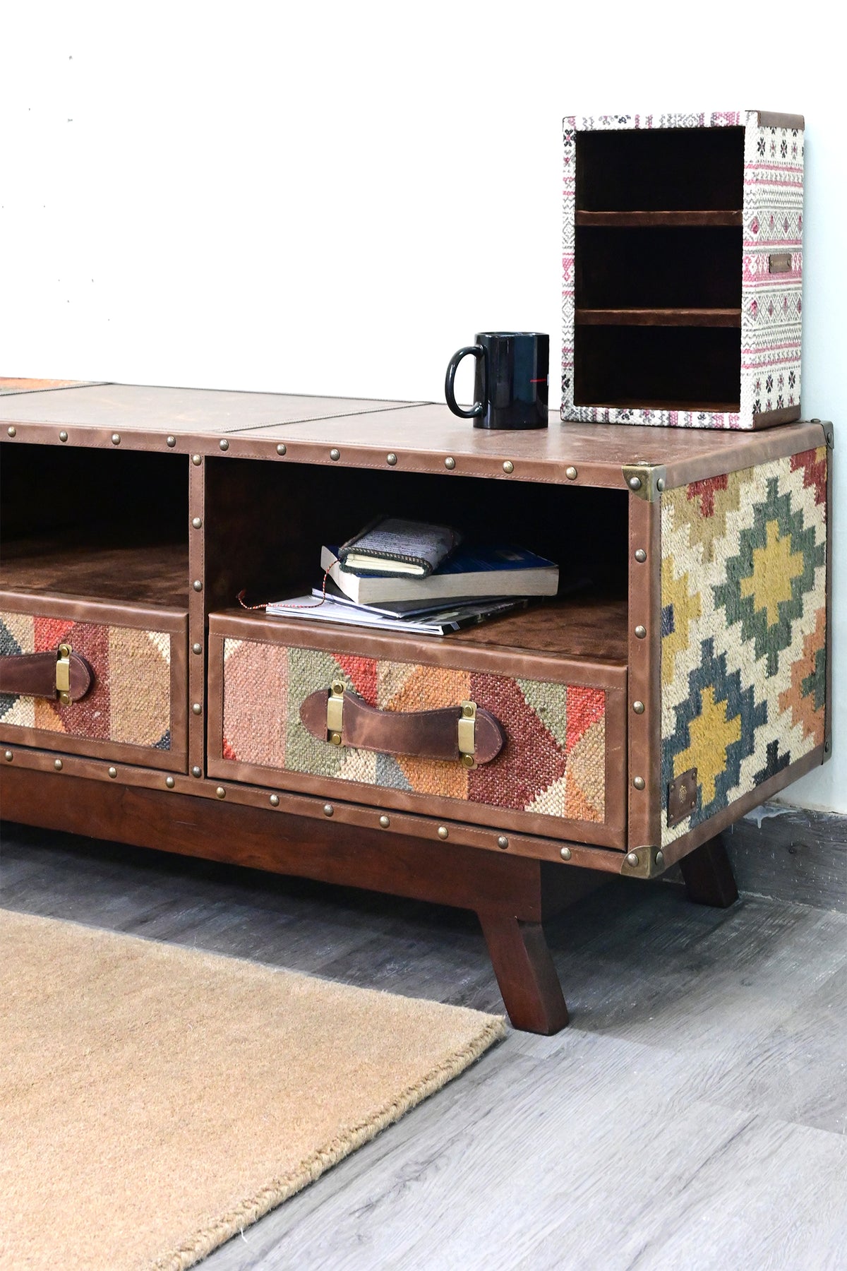 Right end of the Ranakpur TV unit, kilim drawer front, shelf bay and diamond-pattern kilim flank