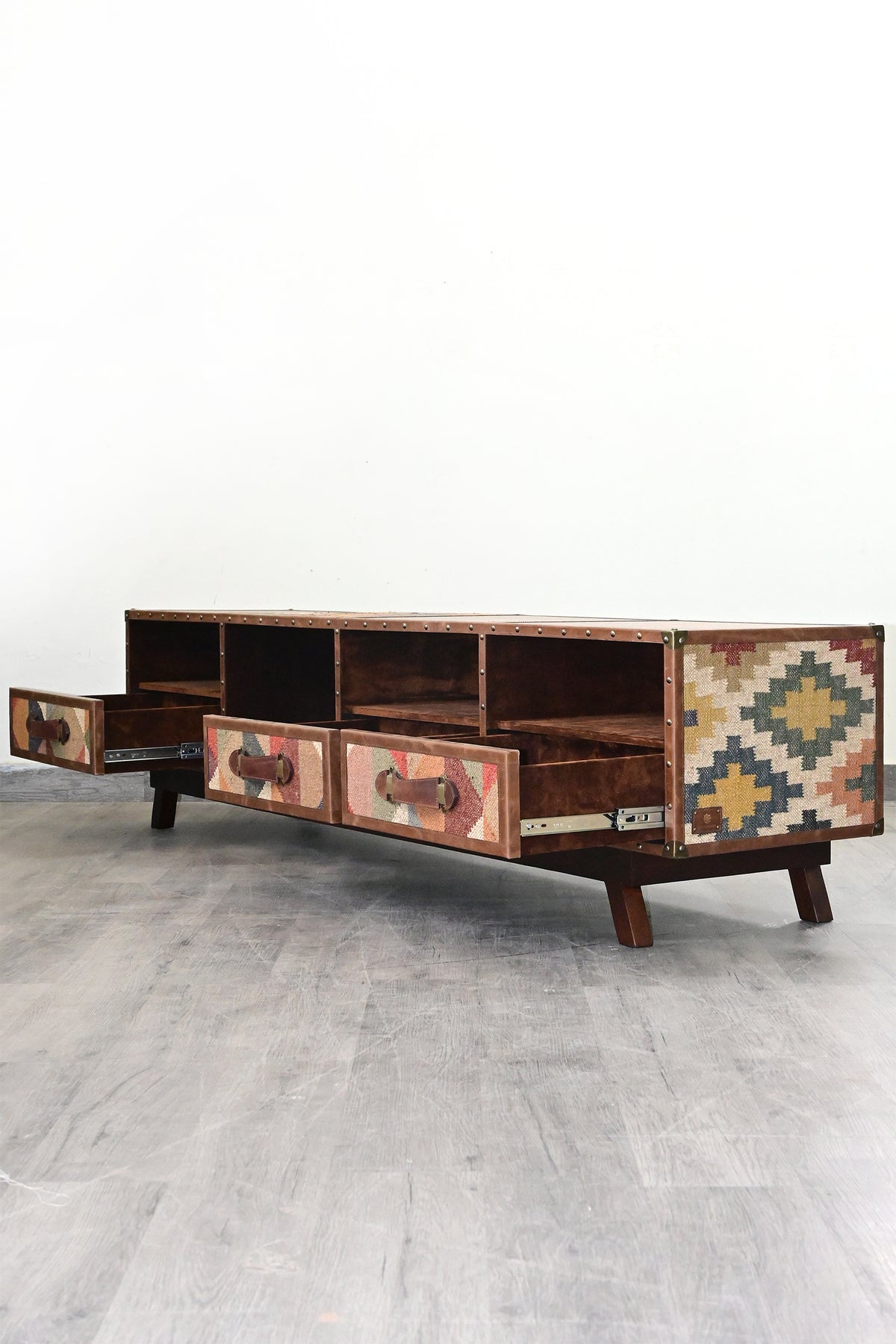 Ranakpur TV unit with three kilim-fronted drawers open, showing the full depth of each drawer