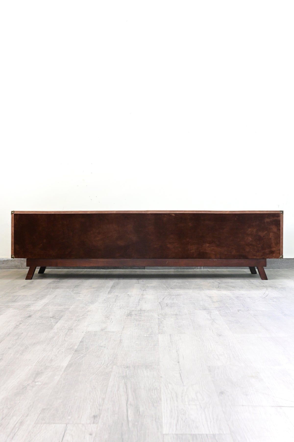 Rear of the Ranakpur TV unit, finished in suede nap with brass caps to the corners