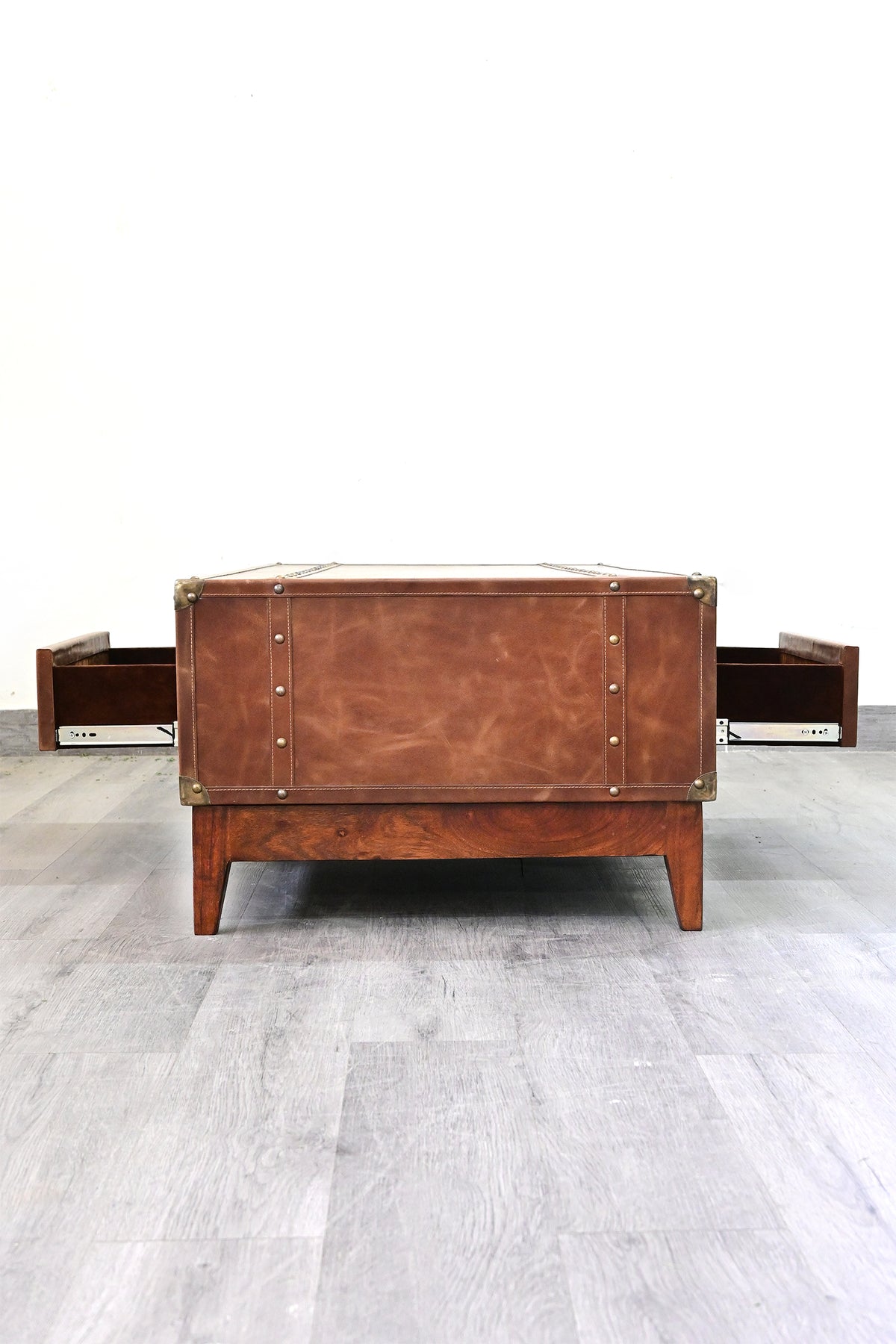Kuchaman leather trunk coffee table, end view with both drawers open on soft-close runners and suede-lined interiors