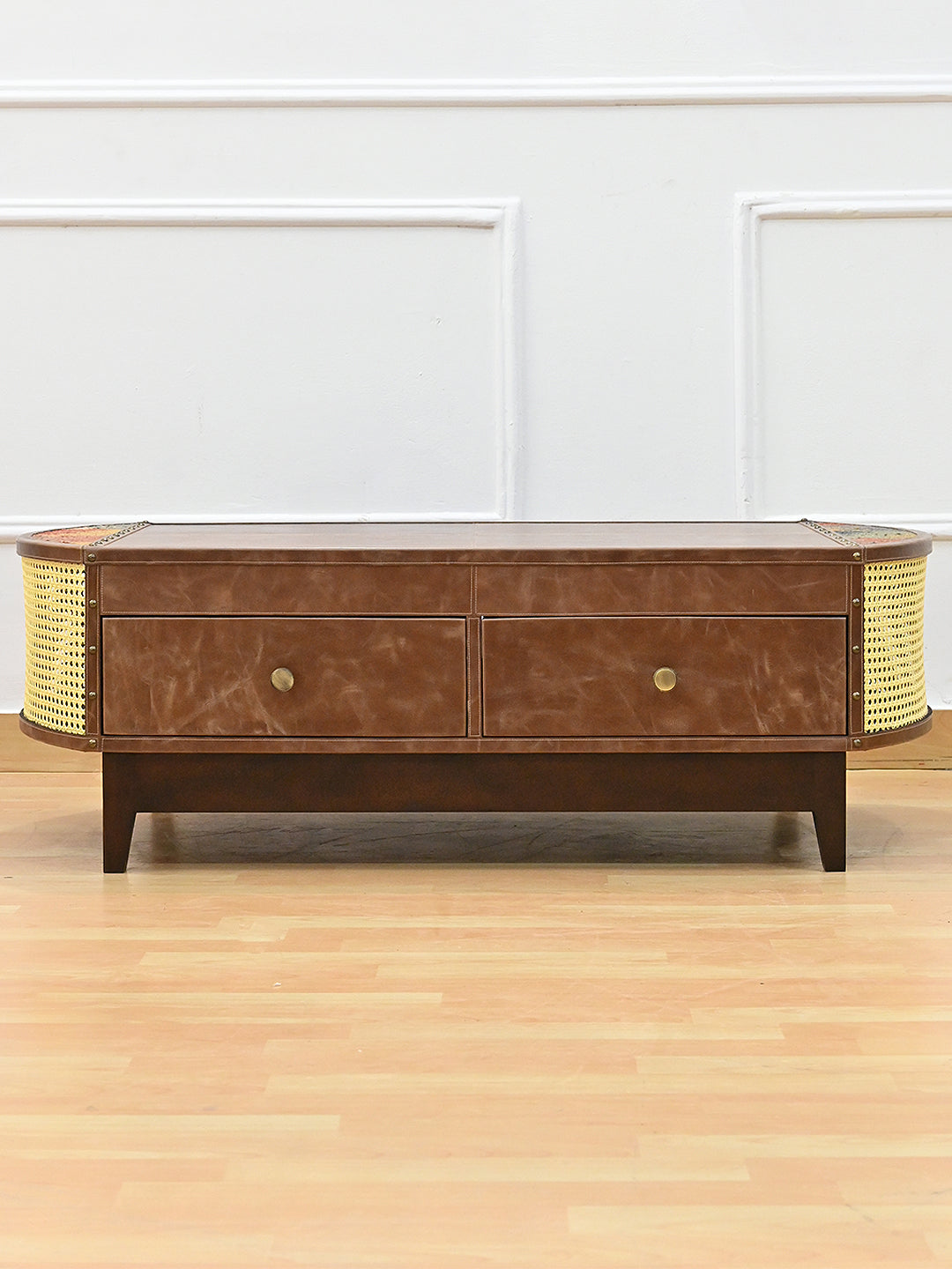 Bisalpur cane and leather coffee table straight on, two leather drawers with brass knobs and cane ends