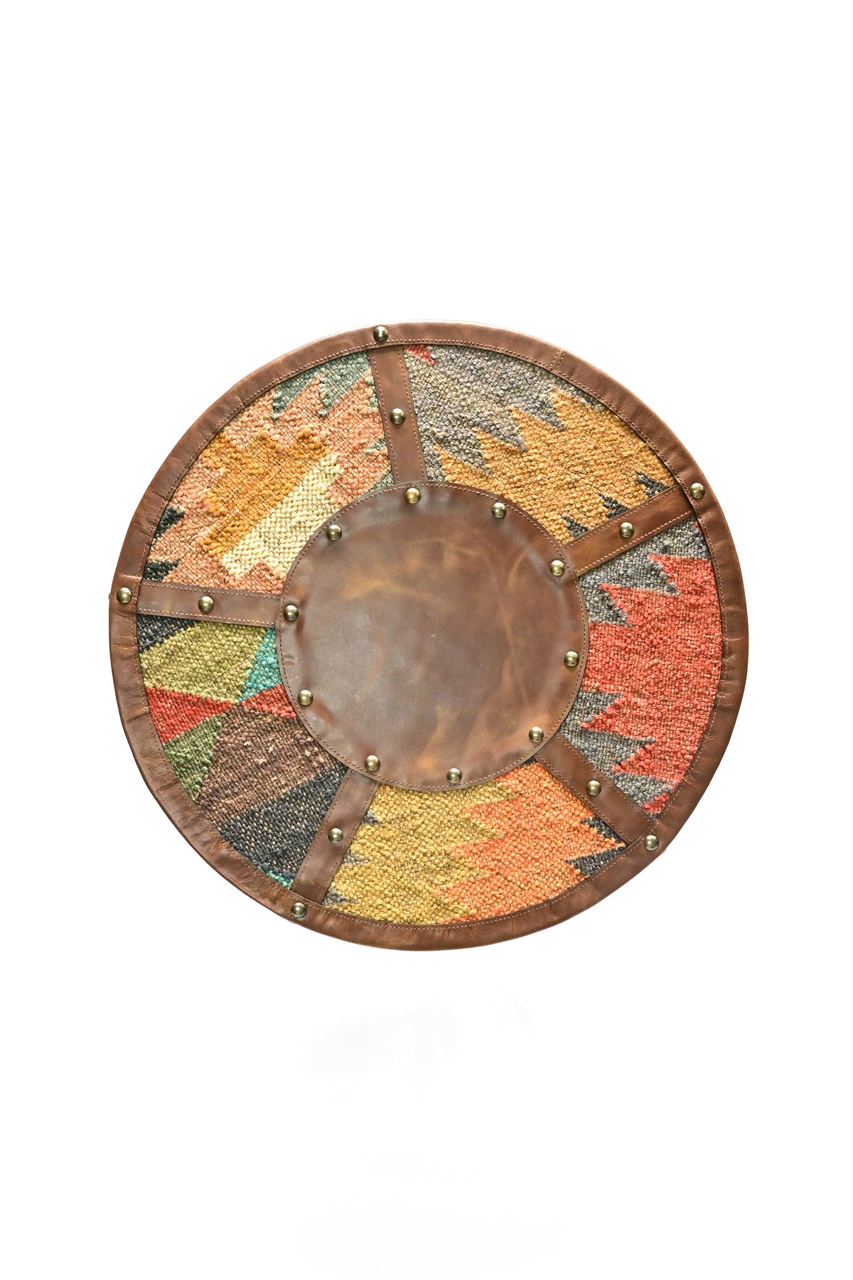 Alwar side table from above: leather medallion with five studded leather spokes over kilim segments