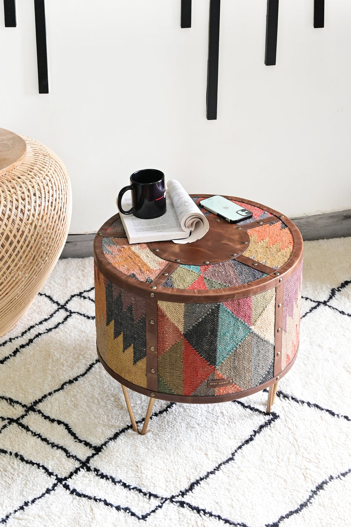 Alwar kilim and leather side table in a living room with a book and mug — Art Avenue, made to order