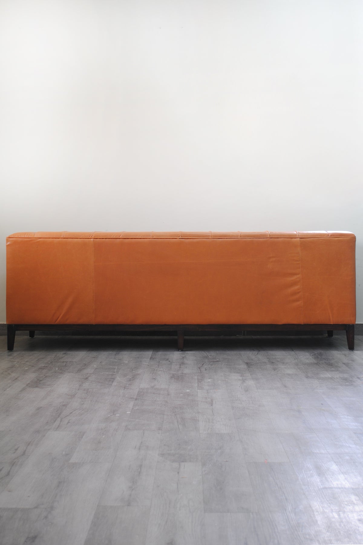 Rear elevation of the Santiago leather sofa in panelled tan hide