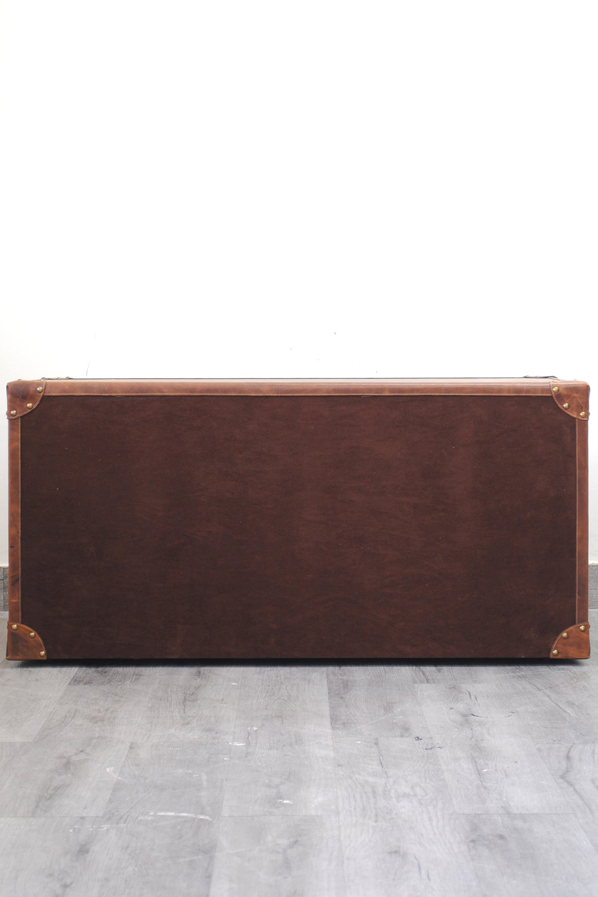 Rear of the Deogarh leather drawer trunk, finished in velvet suede with brass corner caps