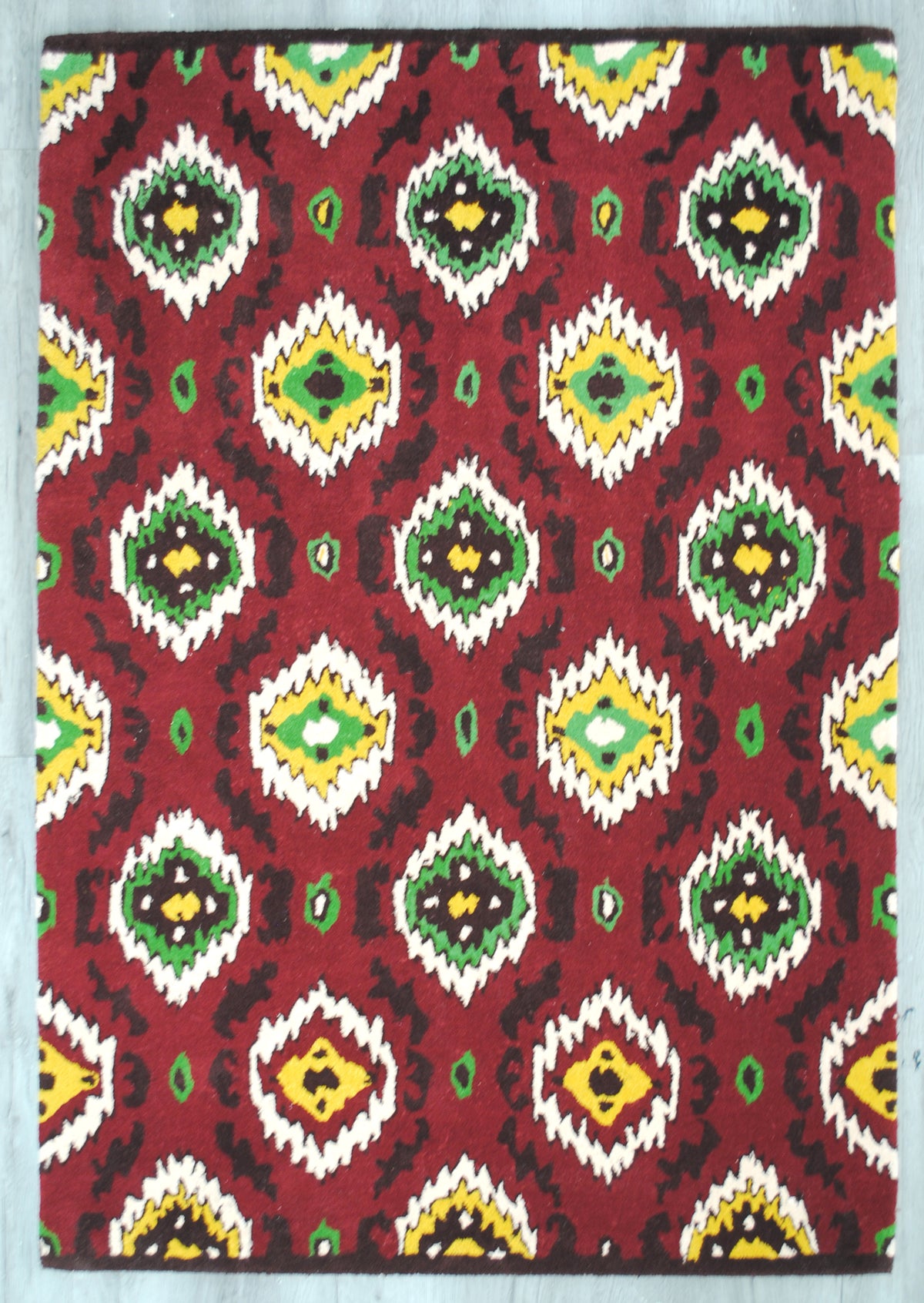 Sambalpur ikat rug laid flat on a grey floor