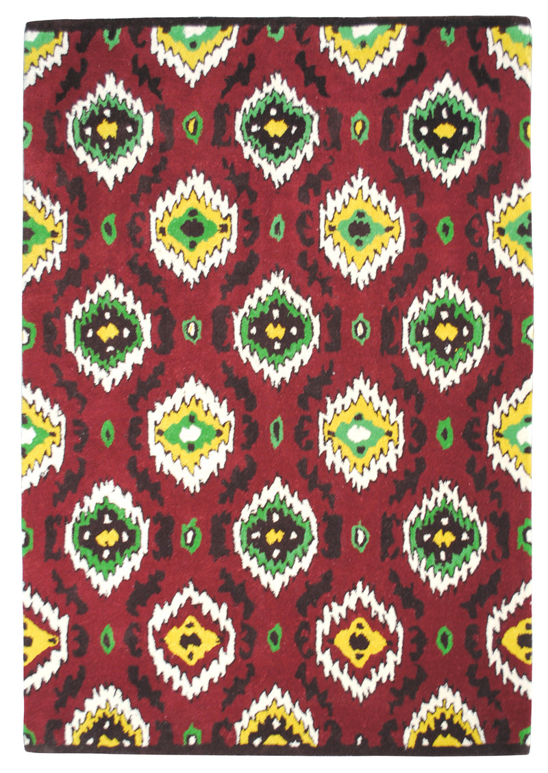 Sambalpur hand-tufted wool rug from above: rows of saw-tooth ikat medallions in saffron, leaf green and ivory on a crimson field