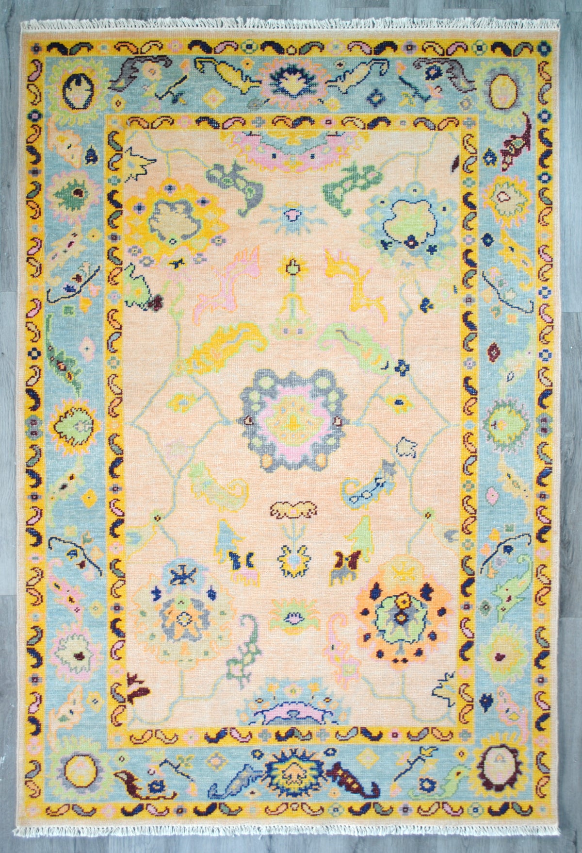 Mysore Hand-Knotted Rug laid flat on a grey wooden floor, full view — Art Avenue