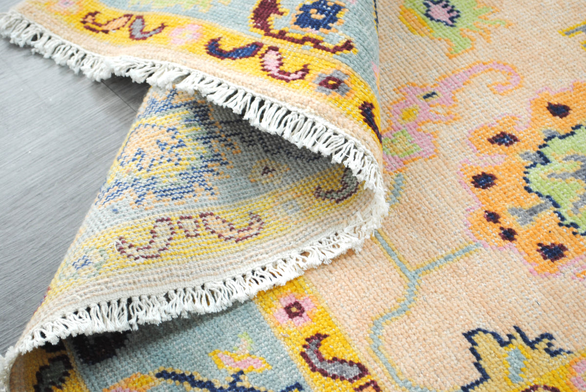 Reverse of the Mysore Hand-Knotted Rug beside the wool pile, showing the cotton foundation and fringe — Art Avenue