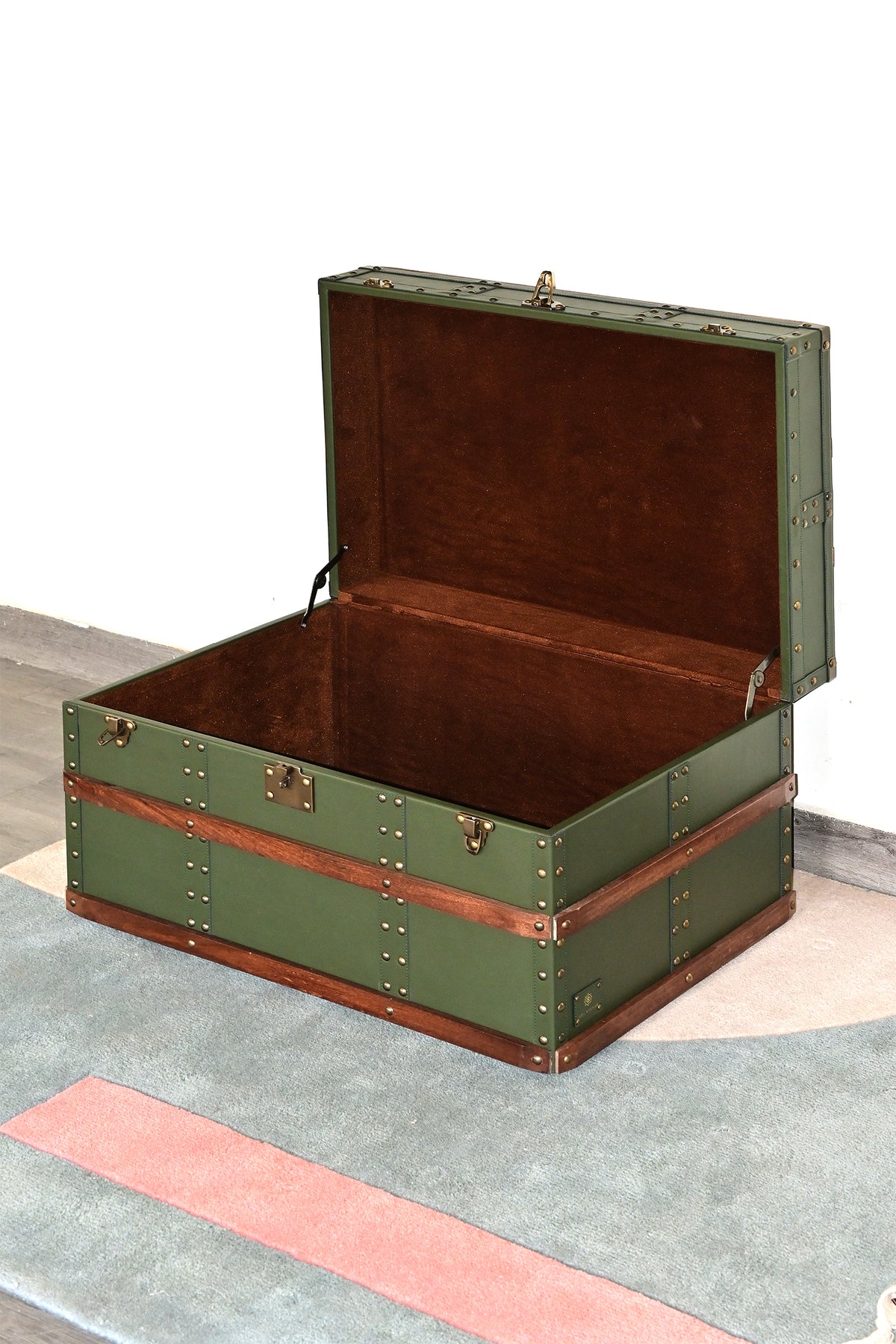 Leather steamer trunk with lid open, showing brown velvet suede lining and folding lid stays — Art Avenue