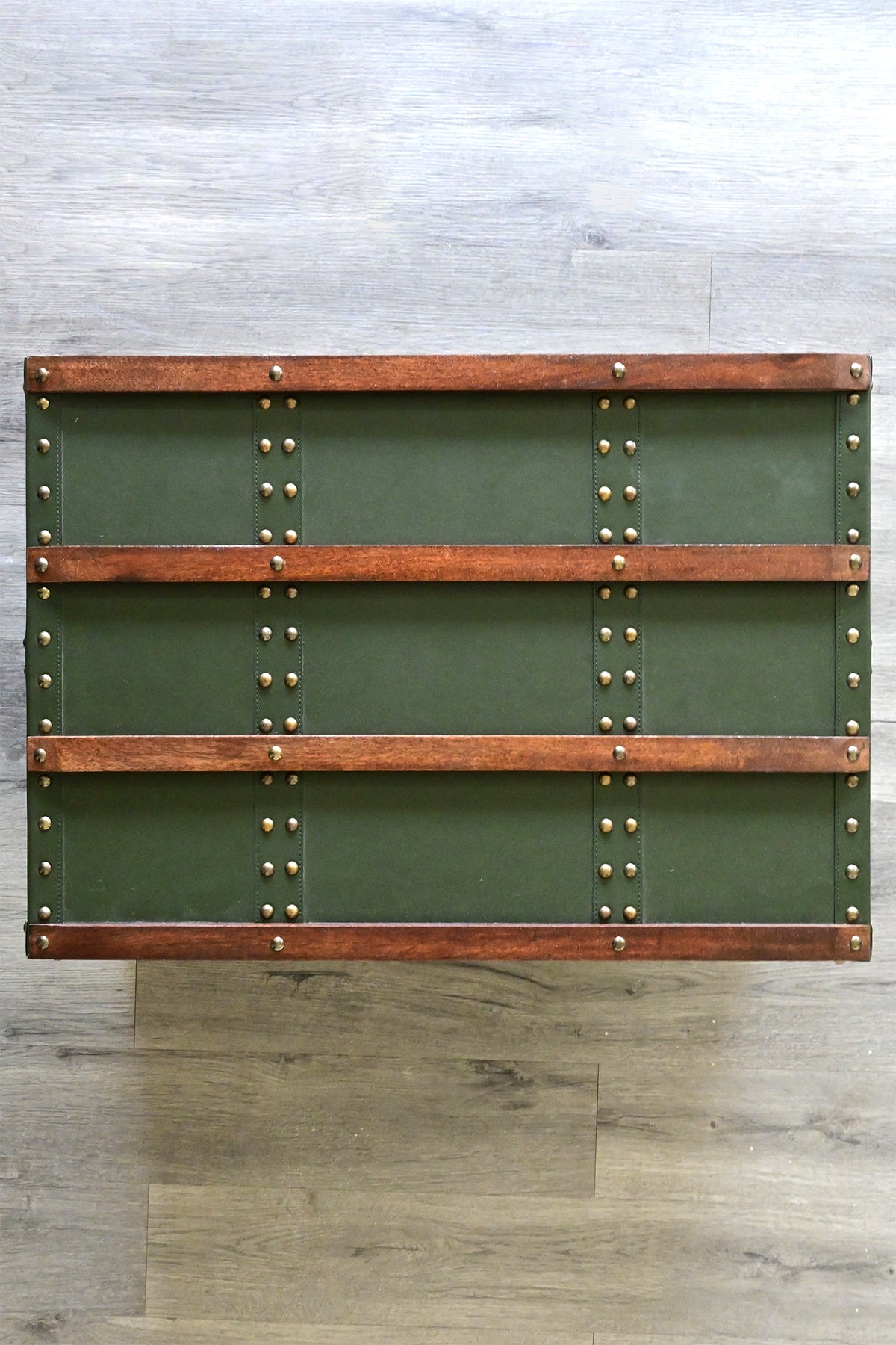 Top view of the trunk lid with four wood bands and studded leather straps — Art Avenue