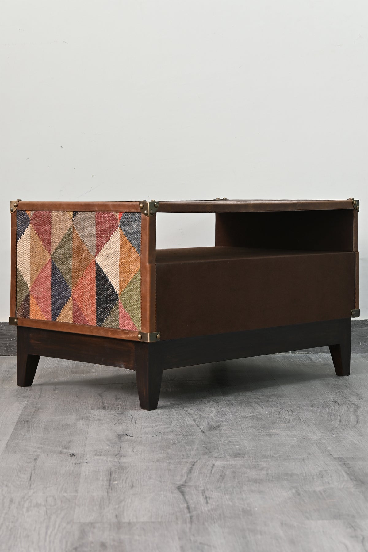 Open cable bay of the Barmer TV unit, leather-lined and open at the rear for cable routing