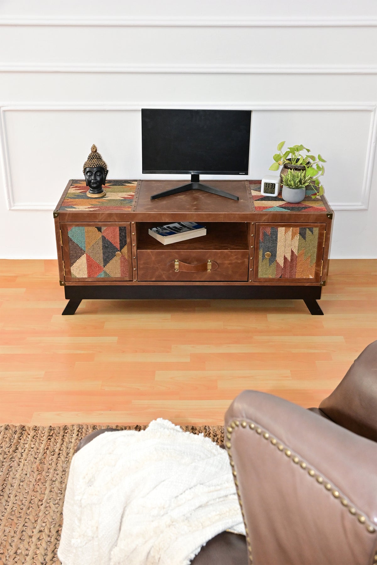 Karauli TV unit from the front, with kilim insets on either end of the leather top