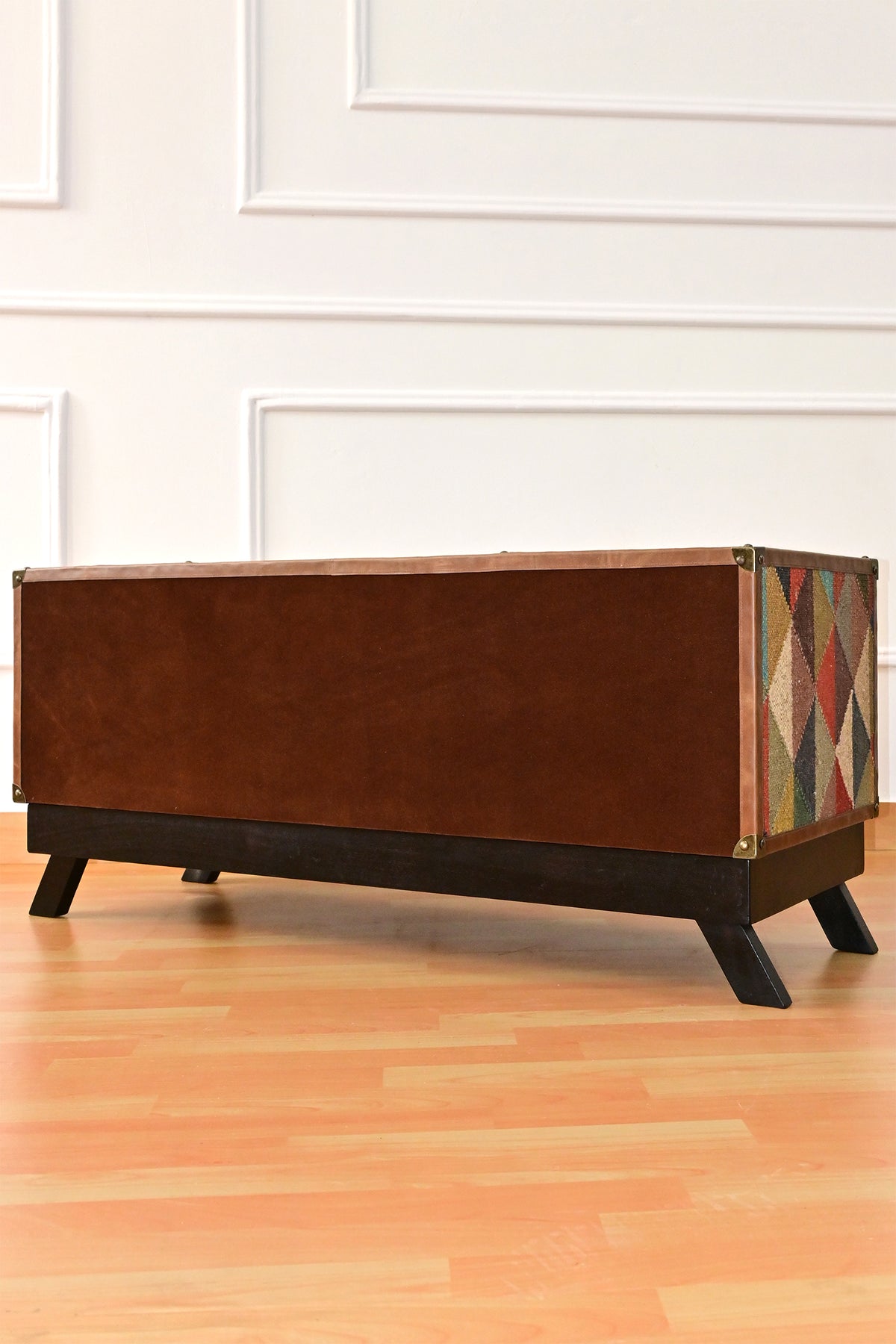 Back of the Karauli TV unit finished in suede with a leather border