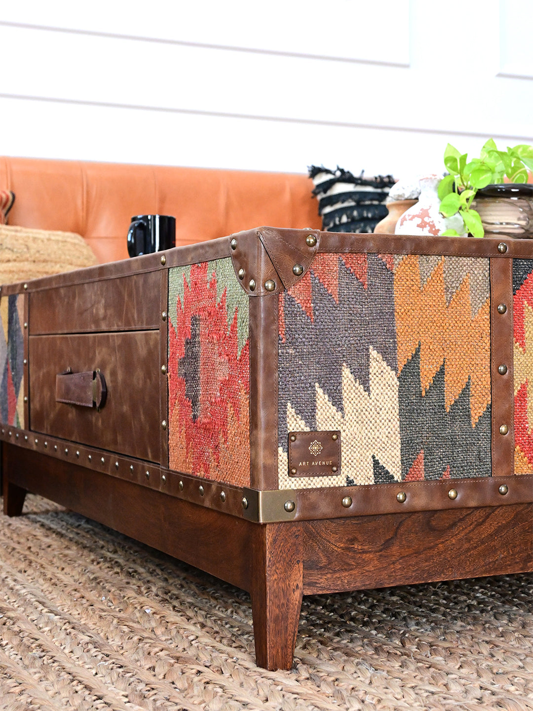 Low angle of the Mandawa kilim coffee table on a jute rug, kilim side and solid wood plinth, Art Avenue