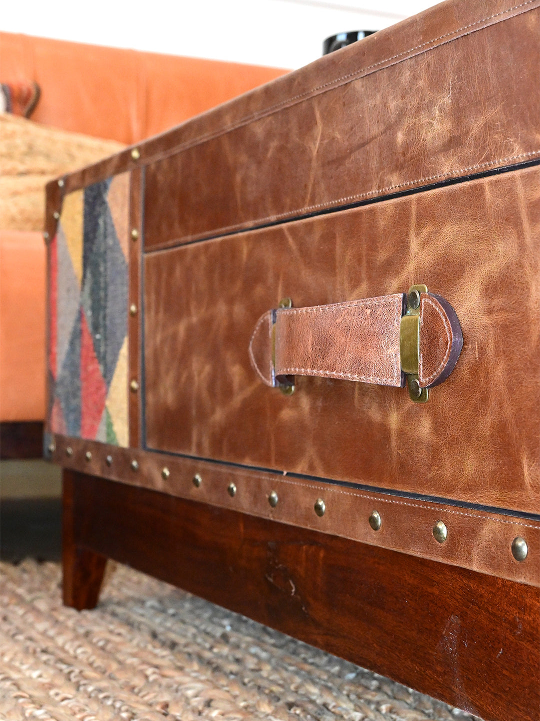Detail of the leather drawer front and saddle-stitched strap handle with brass plates, Mandawa coffee table