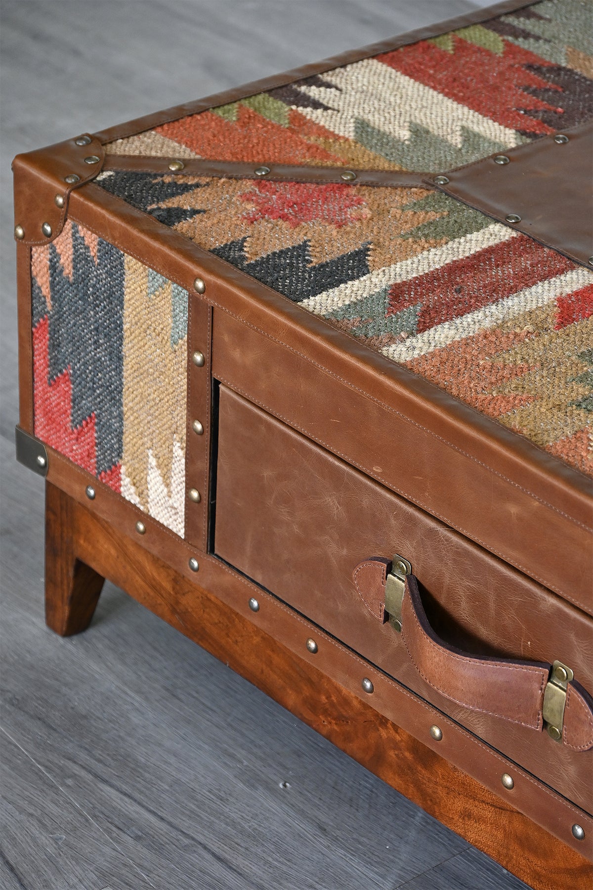 Top corner detail with kilim weave, leather binding and brass-plated strap handle